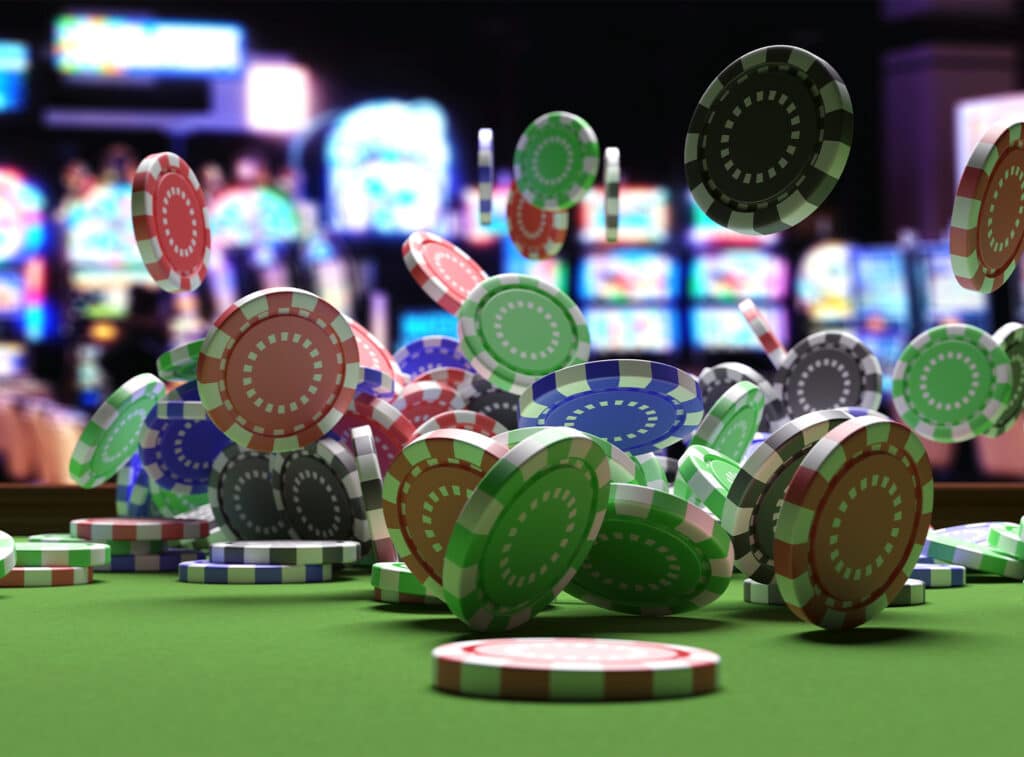 Poker chips falling on tablee